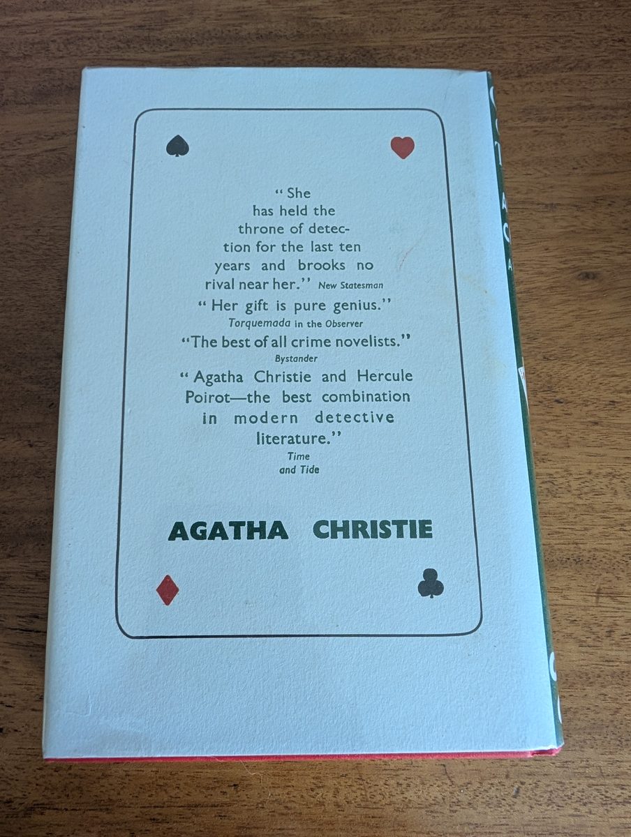 Back cover of Cards on the Table by Agatha Christie