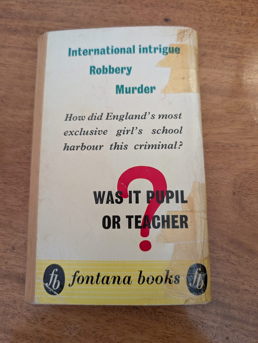 Back cover of Cat Among the Pigeons by Agatha Christie