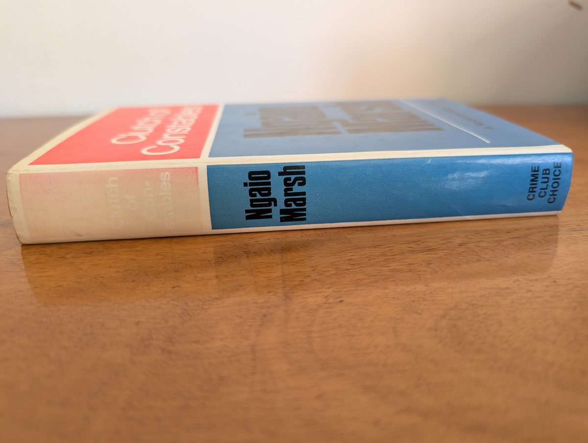 A photograph of the spine of the 1968 first UK hardback edition of Ngaio Marsh's Clutch of Constables. It shows some fading to the spine, as is common with these copies.