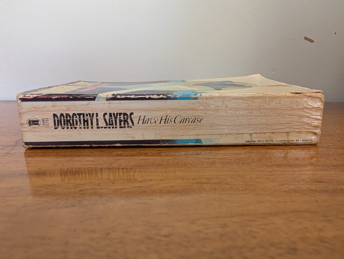 Spine of Have His Carcase - New English Library 1981 paperback, showing significant creasing and fading