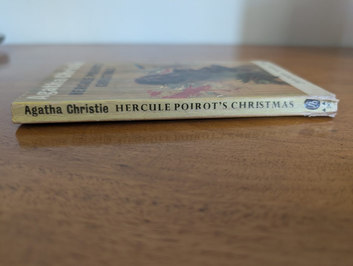 Spine of Hercule Poirot's Christmas, Fontana Books 1963, showing yellowing and library stamp