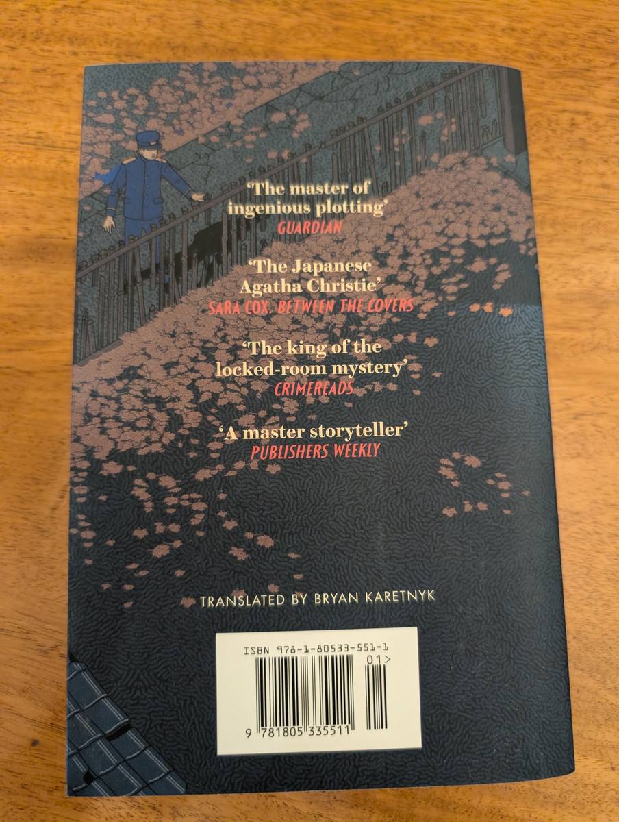 Back cover of Murder at the Black Cat Cafe - Pushkin Vertigo 2025 paperback