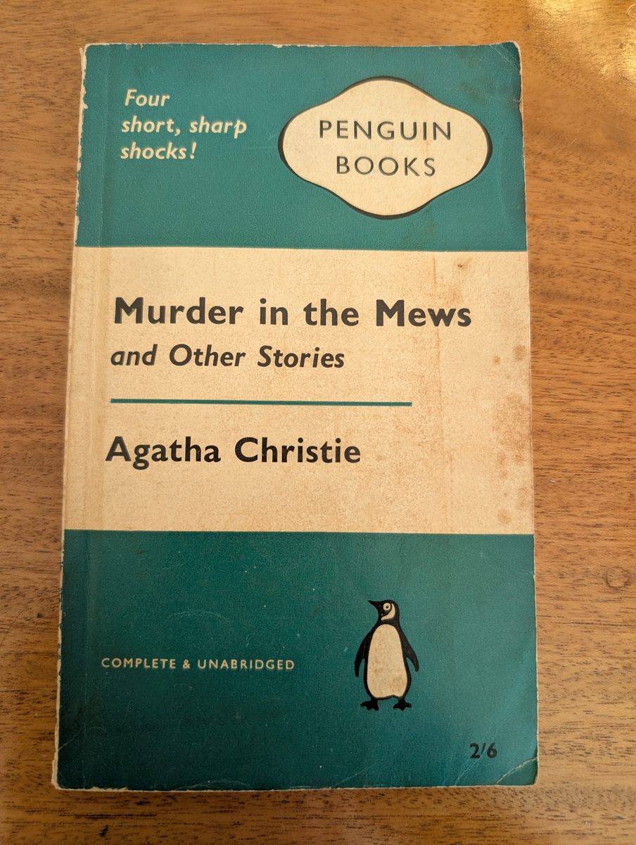 Front cover of Murder in the Mews (and Other Stories) by Agatha Christie, Penguin 1961 paperback