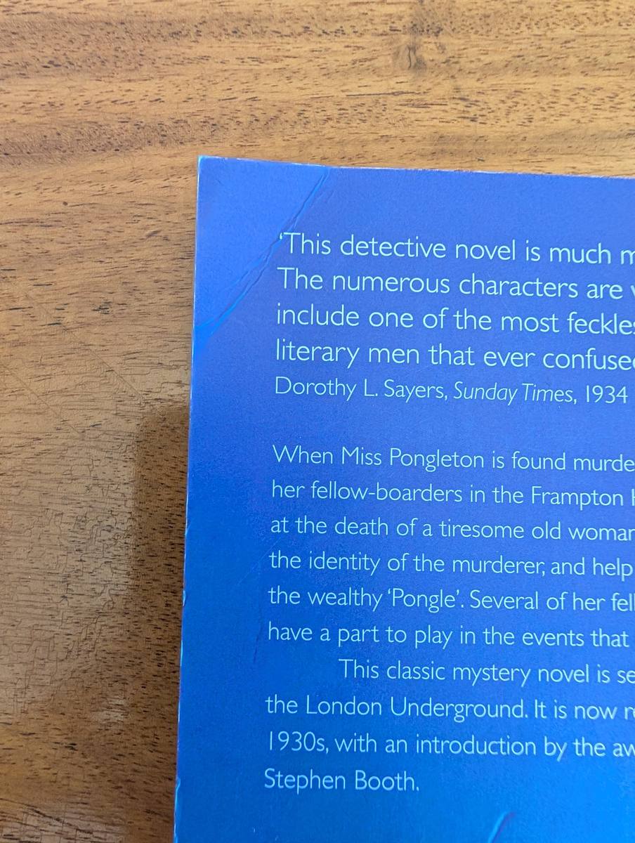Close-up of crease on the corner of the back cover of Murder Underground
