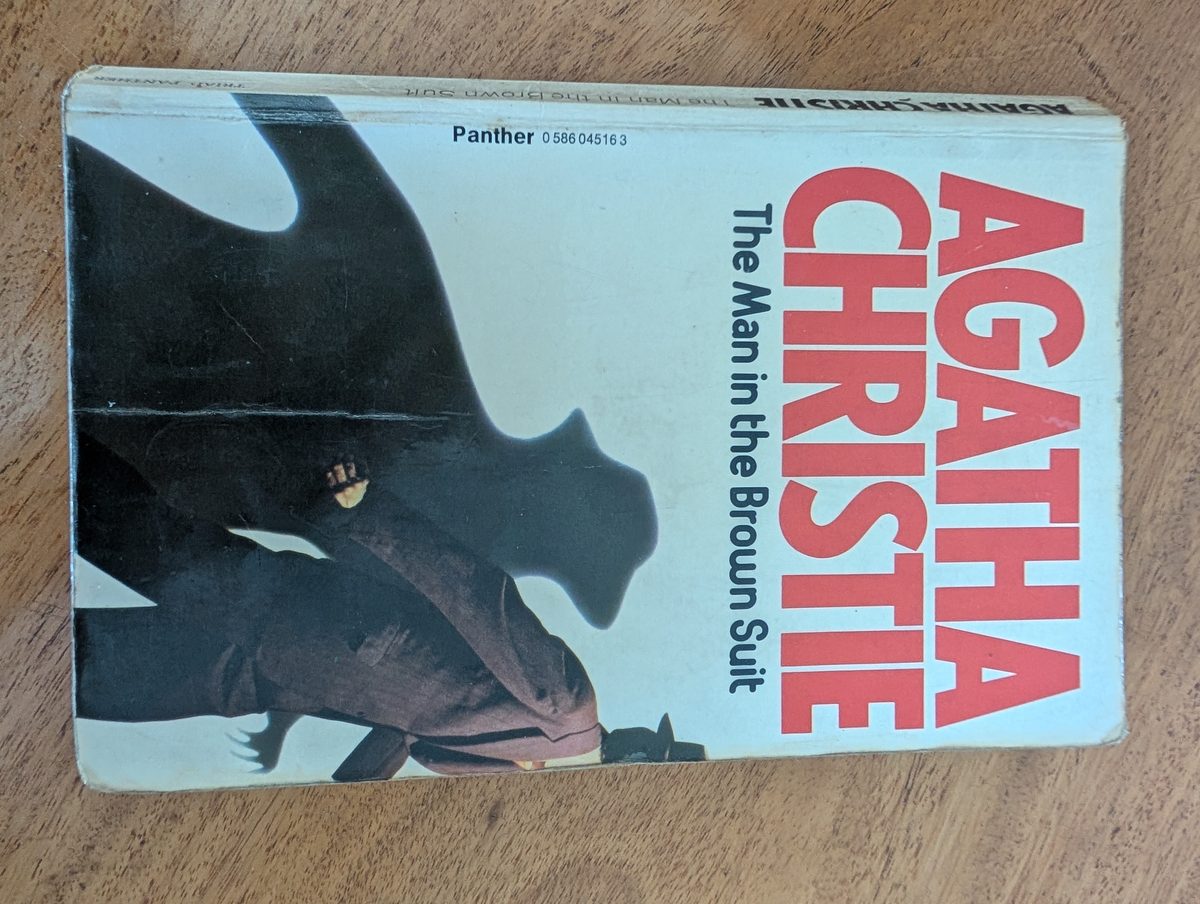 The Man in the Brown Suit by Agatha Christie - Triad Panther 1978 paperback, cream cover with black dragon silhouette