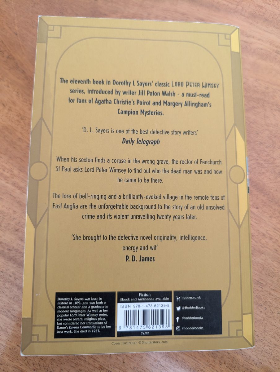 The back cover of the 2016 Hodder & Stoughton paperback of The Nine Tailors by Dorothy L. Sayers. The mustard-yellow cover carries a Daily Telegraph quote, a plot synopsis, a P. D. James quote, a biographical note on Sayers, and an ISBN barcode. Priced at £9.99.